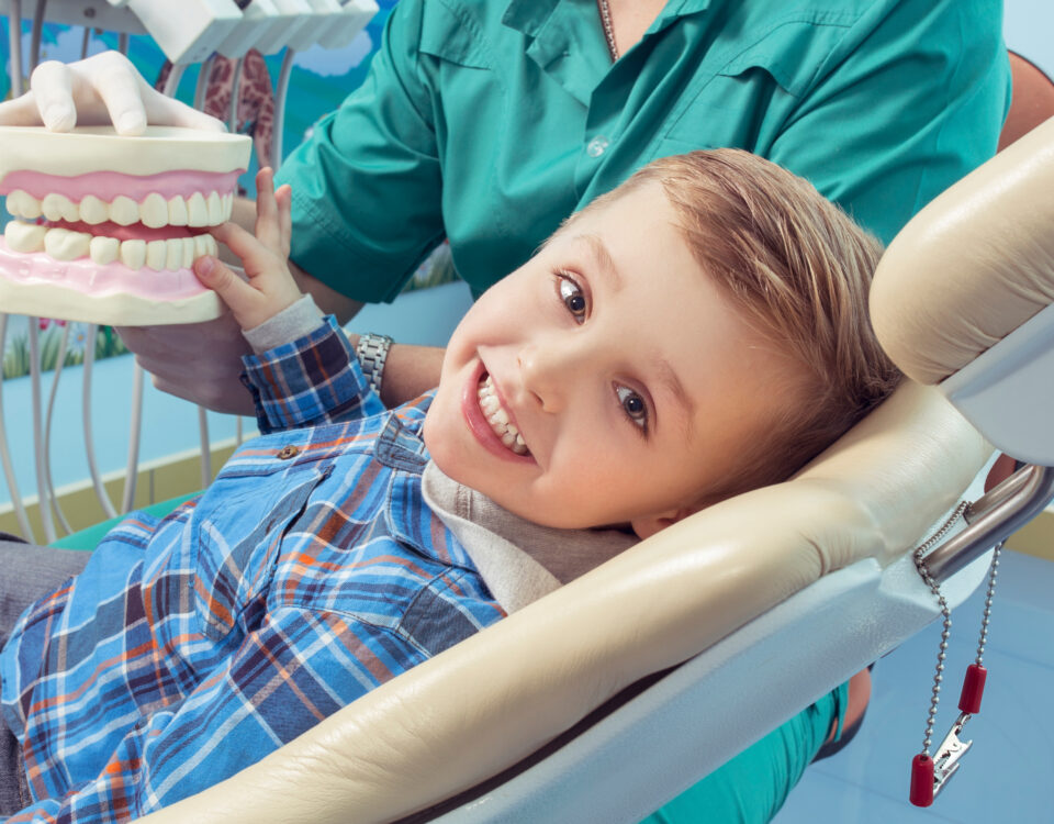 child happy at dental office pediatric dentistry concept