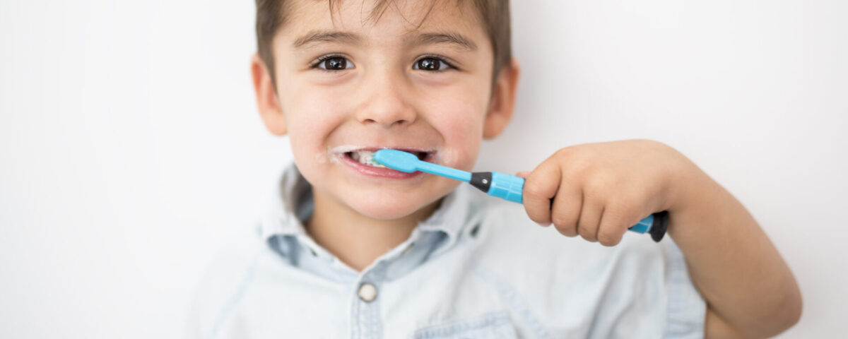 Young boy brushing his teeth